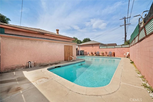 view of swimming pool with a fenced in pool, a patio area, and a fenced backyard