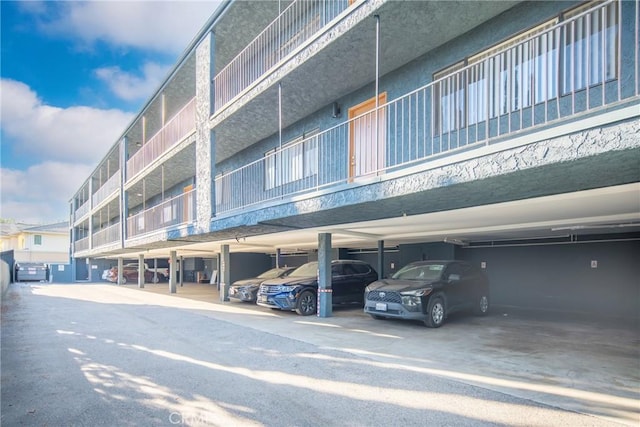 view of property featuring covered parking