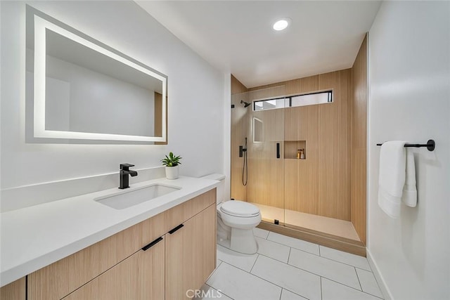 full bath featuring toilet, tile patterned flooring, vanity, and walk in shower