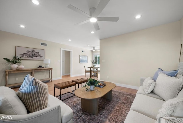 living room featuring recessed lighting, visible vents, wood finished floors, and ceiling fan