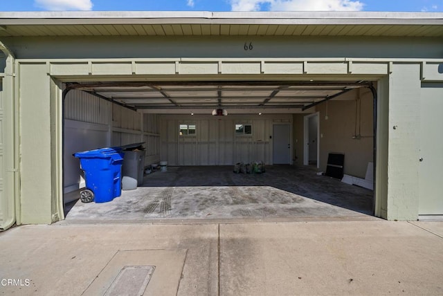garage with concrete driveway