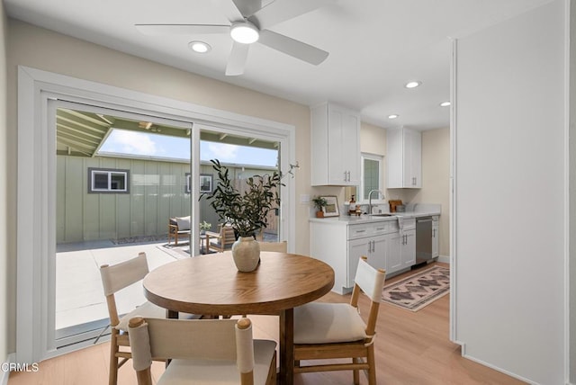 dining area with light wood-style flooring, a ceiling fan, and recessed lighting