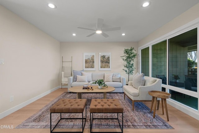 living room featuring recessed lighting, baseboards, a ceiling fan, and wood finished floors