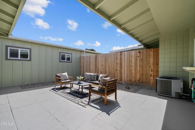 view of patio / terrace featuring an outdoor living space, fence, and central AC unit