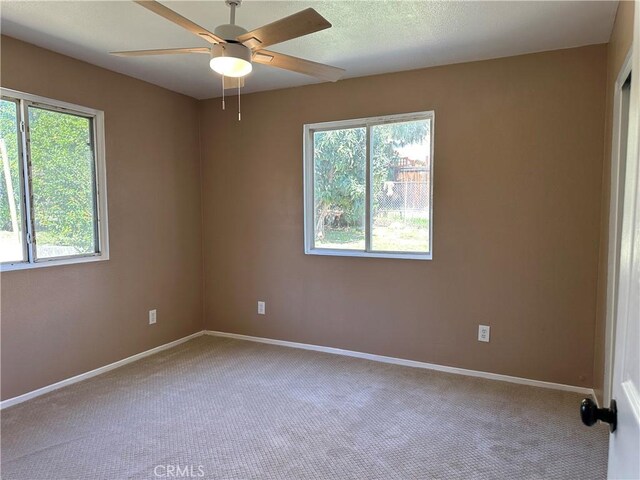 878 E Holly St, Rialto, CA 92376 - carpeted empty room with ceiling fan and baseboards