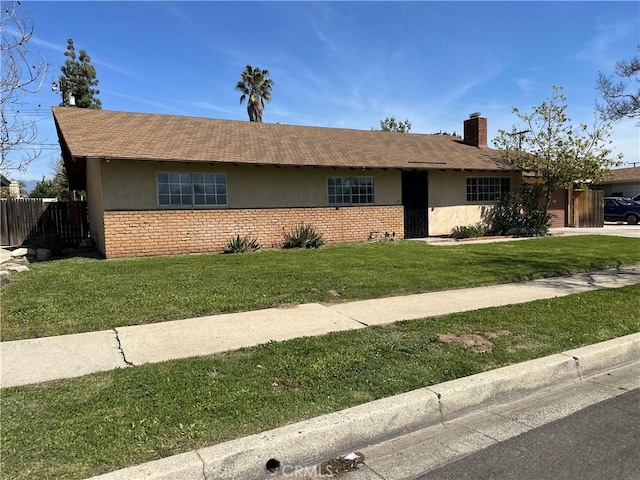 878 E Holly St, Rialto, CA 92376 - single story home featuring stucco siding, an attached garage, roof with shingles, and a chimney