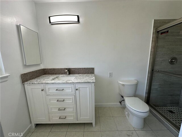 878 E Holly St, Rialto, CA 92376 - full bathroom featuring a stall shower, vanity, and tile patterned floors