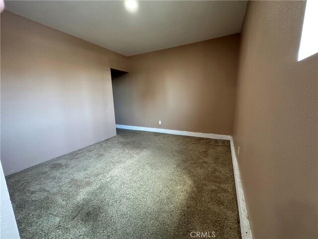 878 E Holly St, Rialto, CA 92376 - empty room featuring carpet floors