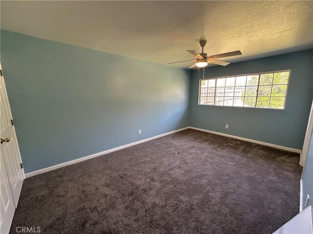 878 E Holly St, Rialto, CA 92376 - empty room featuring ceiling fan and dark carpet