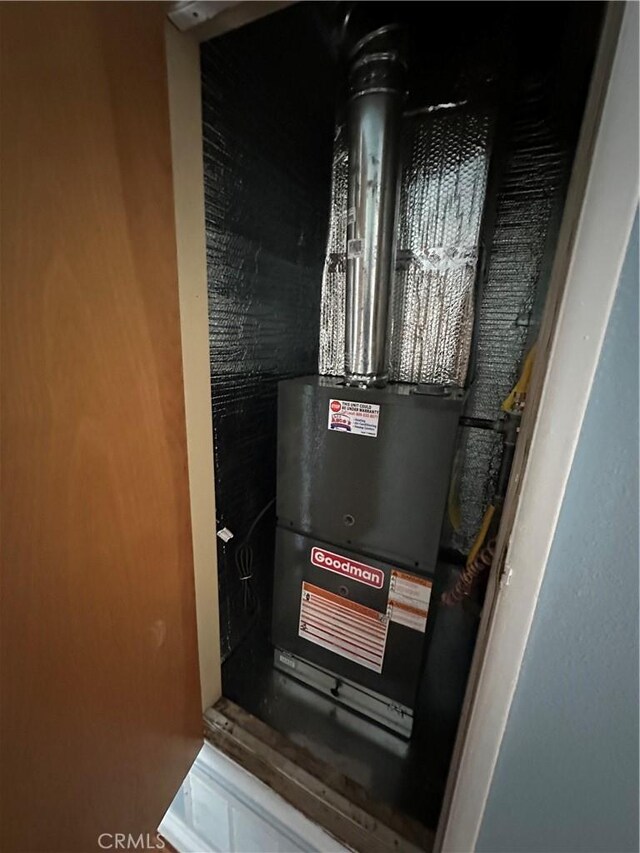 878 E Holly St, Rialto, CA 92376 - utility room featuring heating unit