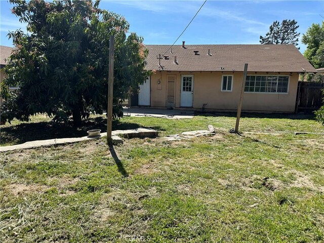 878 E Holly St, Rialto, CA 92376 - back of house with a patio area, stucco siding, and a shingled roof