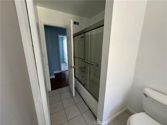 878 E Holly St, Rialto, CA 92376 - full bath featuring enclosed tub / shower combo and tile patterned floors