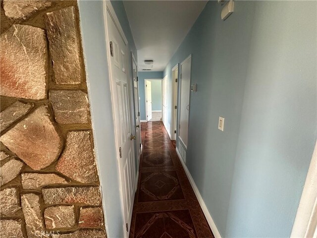 878 E Holly St, Rialto, CA 92376 - hallway featuring tile patterned flooring and baseboards