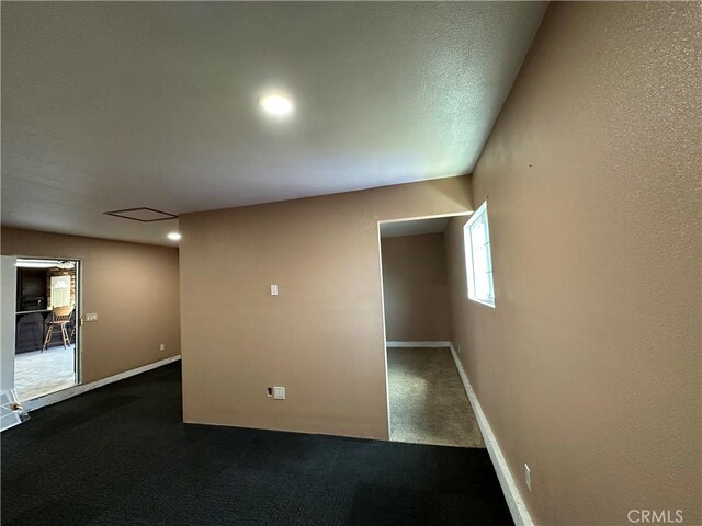 878 E Holly St, Rialto, CA 92376 - unfurnished room with dark carpet and baseboards
