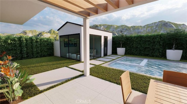 view of patio / terrace featuring an outbuilding and a mountain view