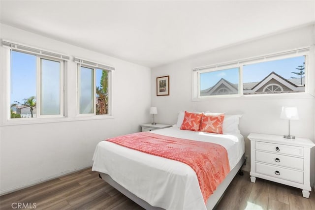bedroom featuring wood finished floors