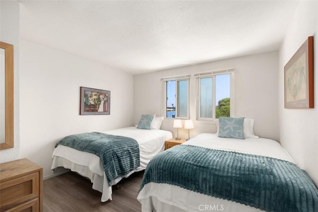 bedroom with wood finished floors
