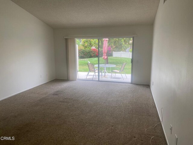 1208 Village 1 Unit 1208, Camarillo, CA 93012 - carpeted empty room with a textured ceiling