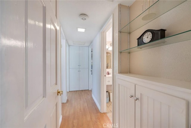 hallway with light wood finished floors