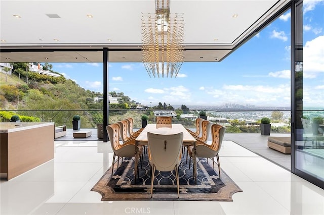interior space featuring floor to ceiling windows, a notable chandelier, and plenty of natural light