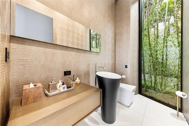 bathroom featuring a freestanding tub and tile patterned floors