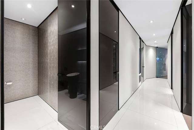corridor featuring recessed lighting and light tile patterned floors
