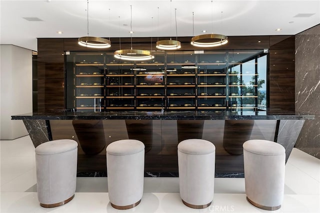 bar featuring decorative light fixtures