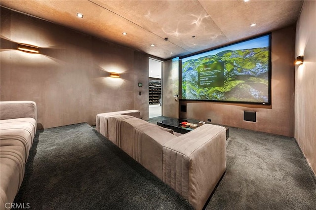cinema with carpet floors and recessed lighting