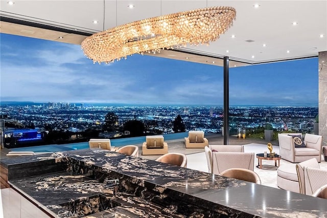 view of patio with a view of city and outdoor dining space