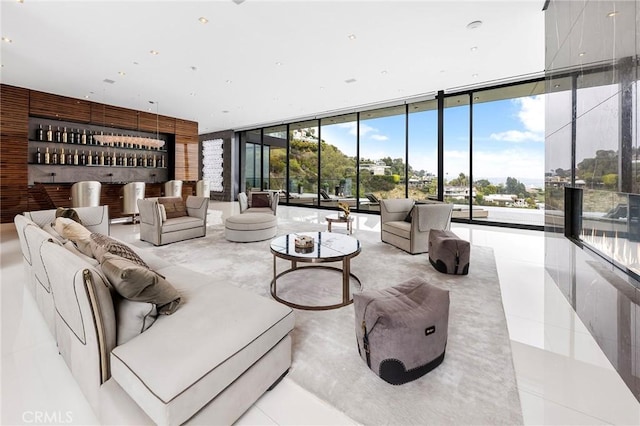 living room with expansive windows and a wealth of natural light