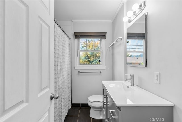 bathroom with crown molding, a healthy amount of sunlight, tile patterned floors, and vanity