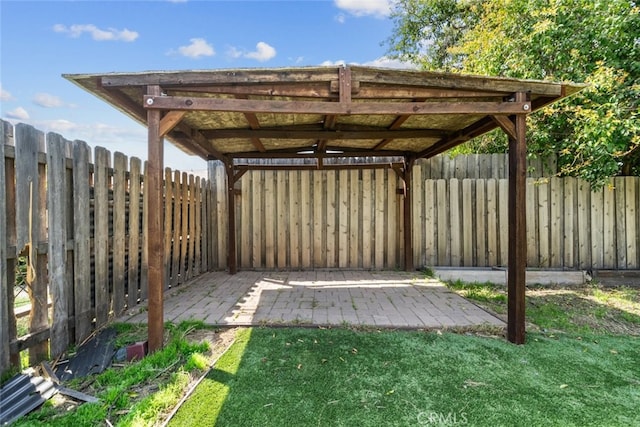 view of yard with a fenced backyard, a pergola, and a patio area
