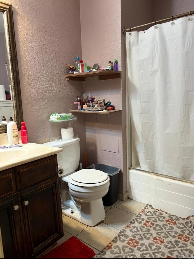 2041 E Grand Ave Unit 48, Escondido, CA 92027 - full bathroom featuring a textured wall, tile patterned flooring, toilet, shower / bath combo with shower curtain, and vanity