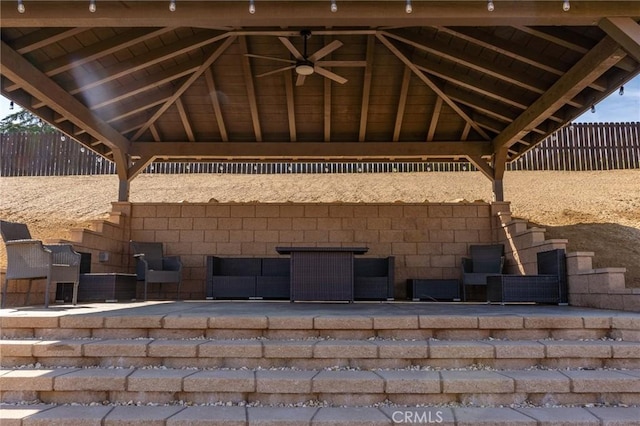 view of patio / terrace with a gazebo, ceiling fan, and fence