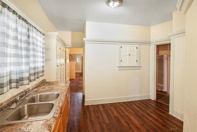 3417 4th Ave, Los Angeles, CA 90018 - kitchen featuring a sink, light countertops, baseboards, and dark wood-type flooring