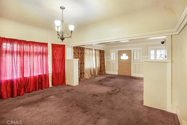 3417 4th Ave, Los Angeles, CA 90018 - carpeted foyer entrance with an inviting chandelier