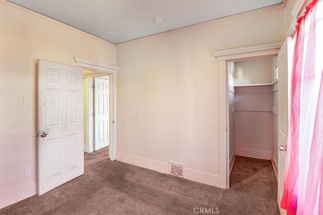 3417 4th Ave, Los Angeles, CA 90018 - unfurnished bedroom with baseboards, ornamental molding, visible vents, and carpet floors