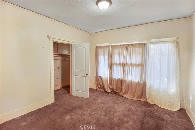 3417 4th Ave, Los Angeles, CA 90018 - unfurnished bedroom with a textured ceiling, a closet, carpet flooring, and baseboards