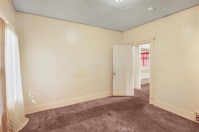 3417 4th Ave, Los Angeles, CA 90018 - carpeted spare room featuring crown molding, baseboards, and a textured ceiling