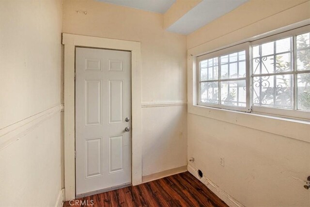 3417 4th Ave, Los Angeles, CA 90018 - empty room featuring dark wood-style flooring and baseboards