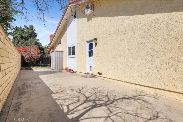 3291 Lemon Dr, Simi Valley, CA 93063 - view of side of property featuring stucco siding, a patio, and fence