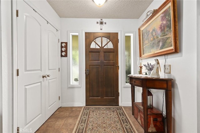 3291 Lemon Dr, Simi Valley, CA 93063 - foyer entrance featuring a textured ceiling and baseboards