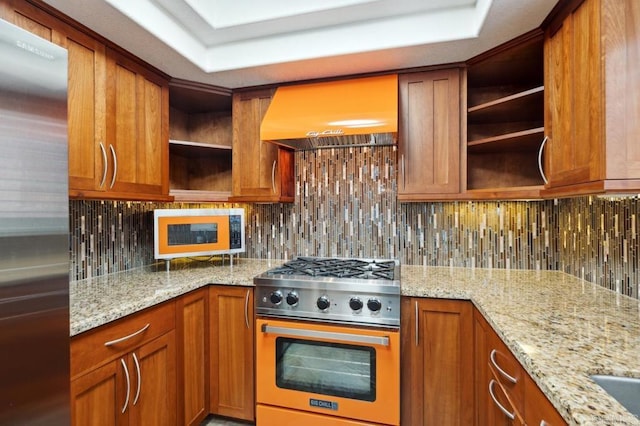 kitchen featuring custom range hood, open shelves, appliances with stainless steel finishes, and tasteful backsplash