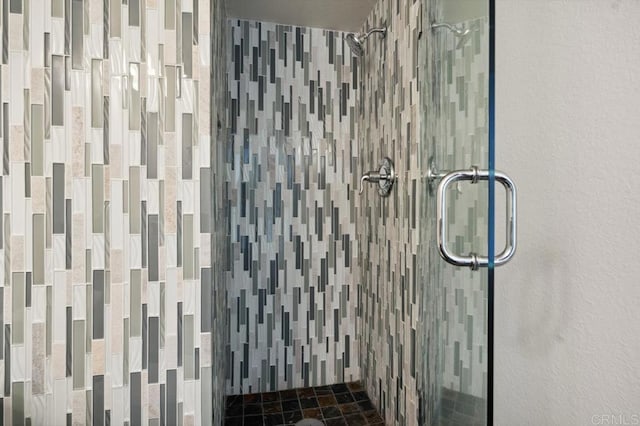 bathroom featuring a shower stall