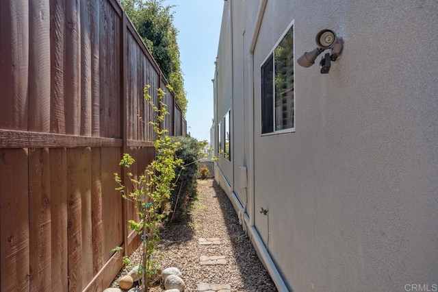 view of property exterior featuring fence