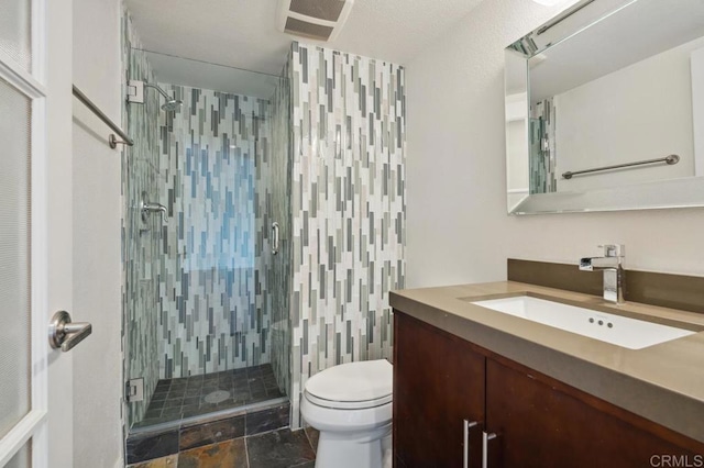 bathroom with vanity, visible vents, toilet, stone finish floor, and a stall shower
