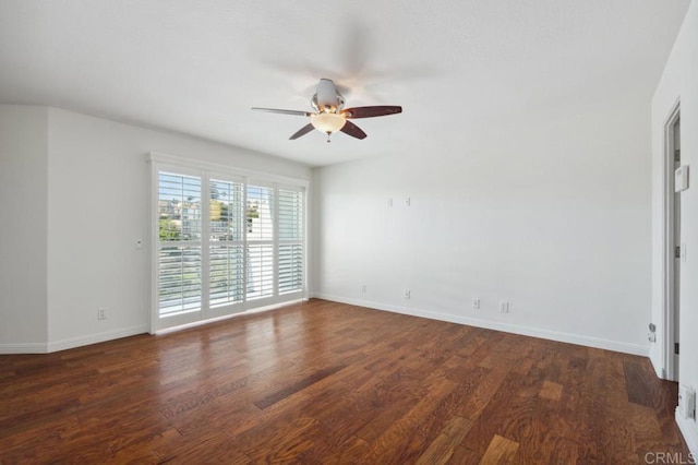 interior space with baseboards, a ceiling fan, and wood finished floors