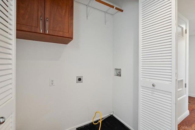 clothes washing area with electric dryer hookup, cabinet space, baseboards, dark wood-style floors, and hookup for a washing machine