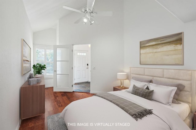 bedroom with baseboards, a ceiling fan, wood finished floors, and high vaulted ceiling