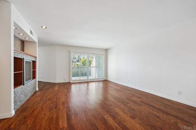 unfurnished living room featuring visible vents, recessed lighting, baseboards, and wood finished floors